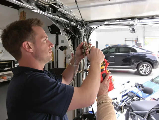 Moreno Valley Garage Door Repair safety certified technician performing cable replacement in Moreno Valley