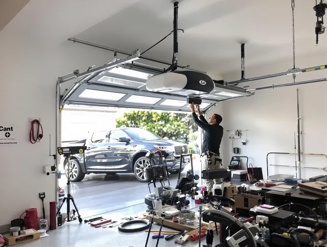 Moreno Valley Garage Door Repair specialist installing smart garage door opener system in Moreno Valley home